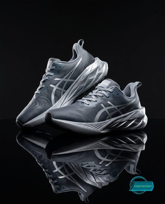 Grey premium mesh running sneakers for men by Mesmerizee on a reflective black background