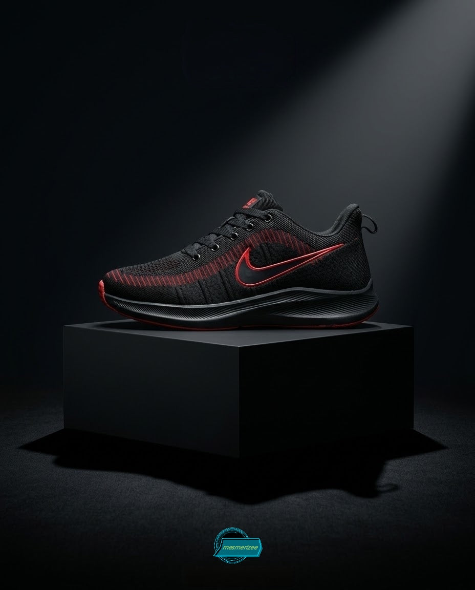 Black and red Nike premium mesh running sneakers for men on a black pedestal.
